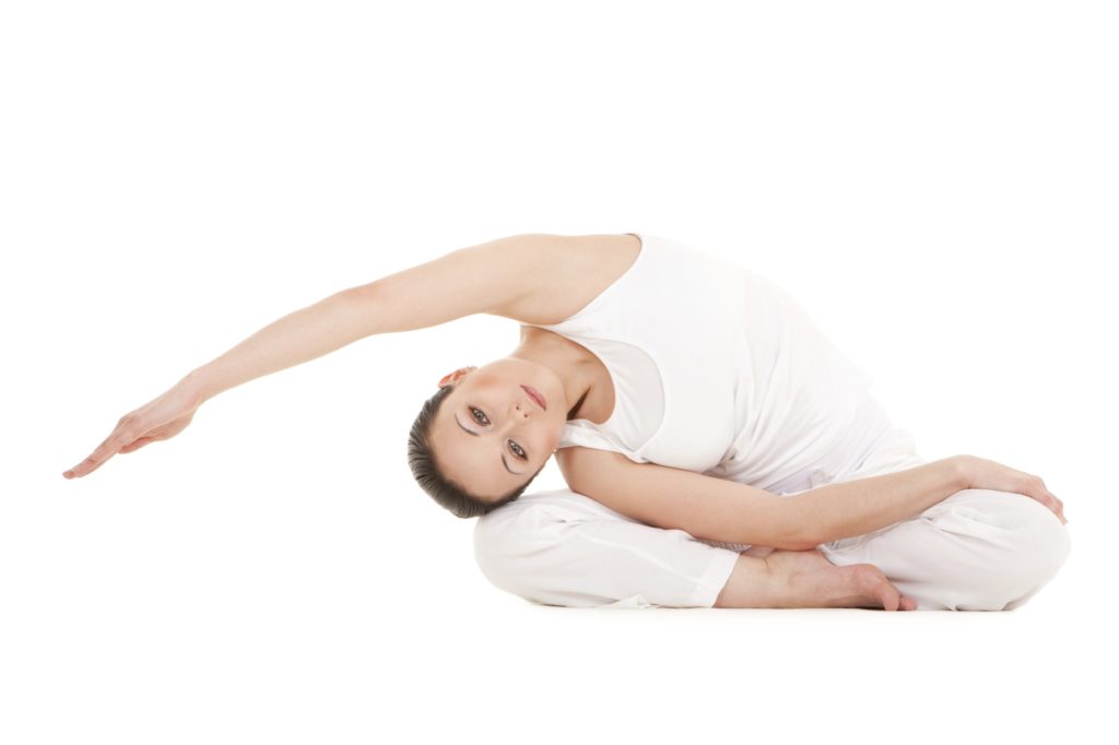 Young woman doing yoga exercise